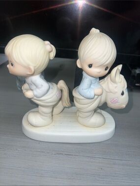 Jim Shore Cream Figurine with Pale Blue and Pink Accents